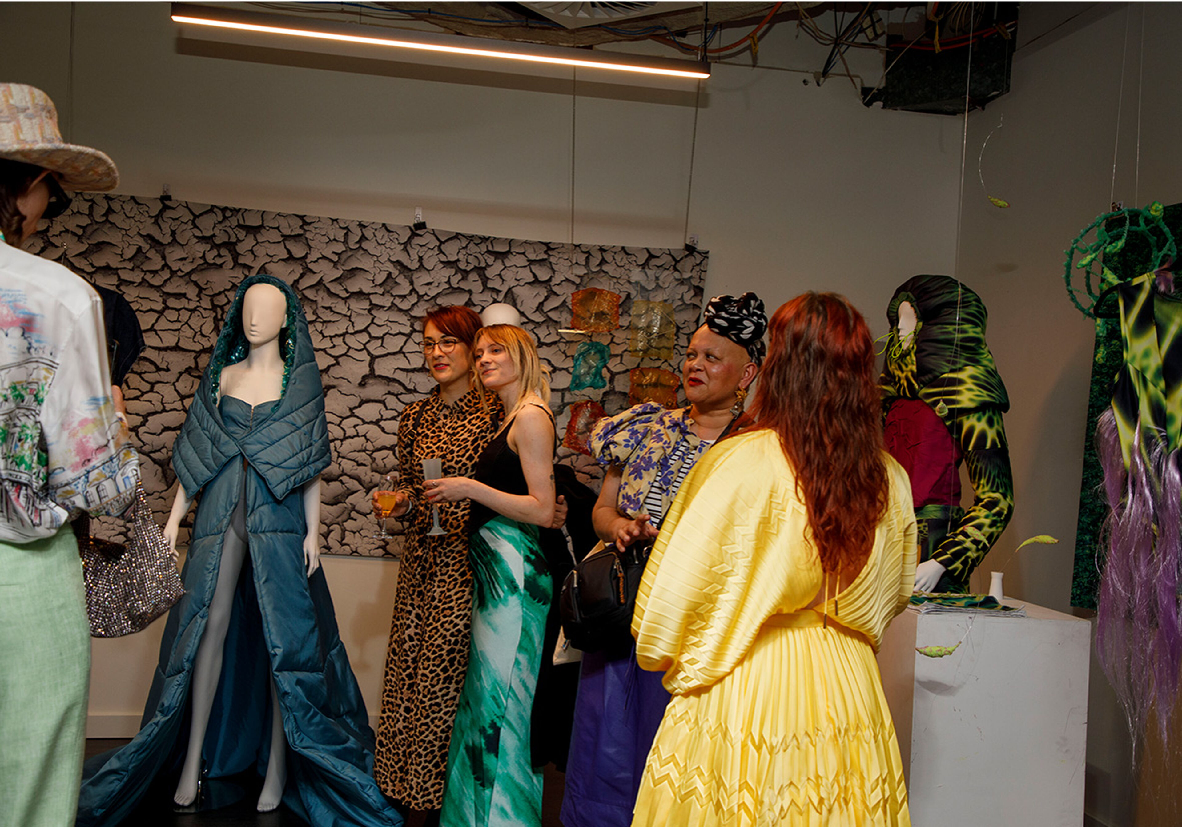 Enthusiasts gather in a vibrant fashion gallery, where the art of dress is celebrated in every corner. 