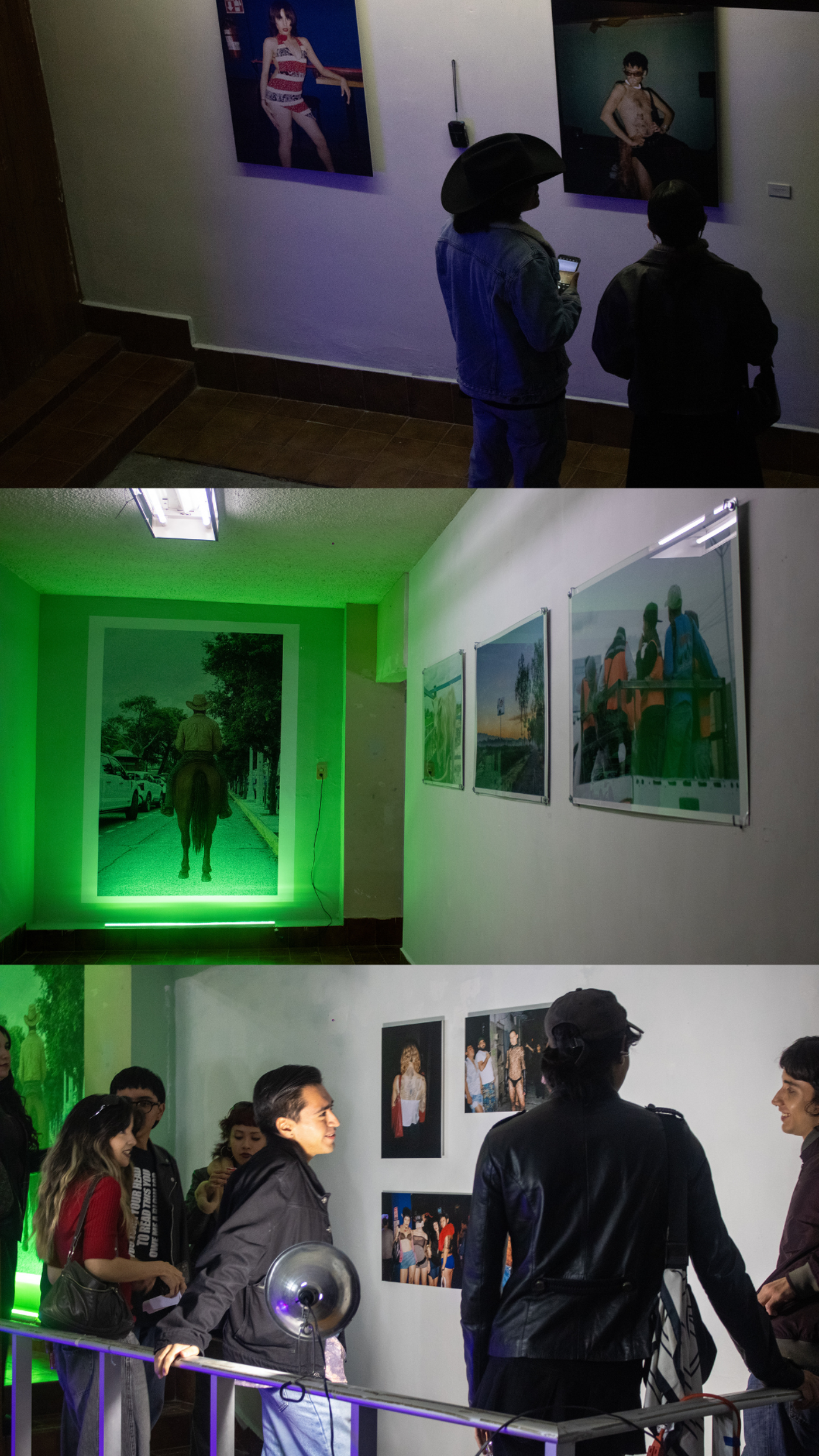 The image shows an art gallery with several photographs on display. People are looking at the art and interacting with each other, enjoying the exhibition.
