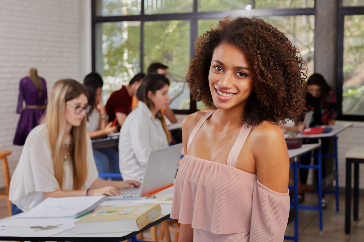 A joyful student stands out in a bustling classroom environment, radiating confidence.