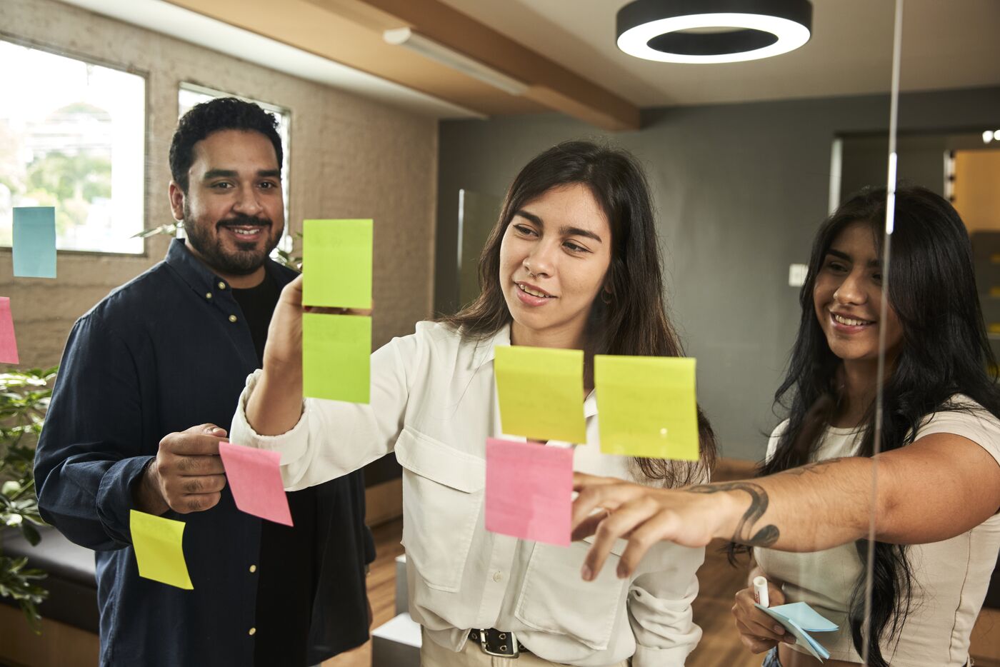 Team Collaboration at a Glass Wall