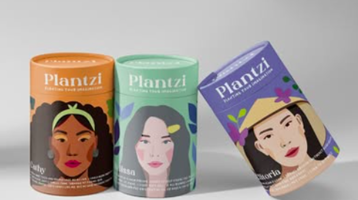 Three cylindrical tea packages from the brand "Plantzi," featuring vibrant illustrations of diverse women on the labels. The designs reflect cultural variety, with orange, green, and purple themes, showcasing the brand's emphasis on inclusivity and herbal blends.