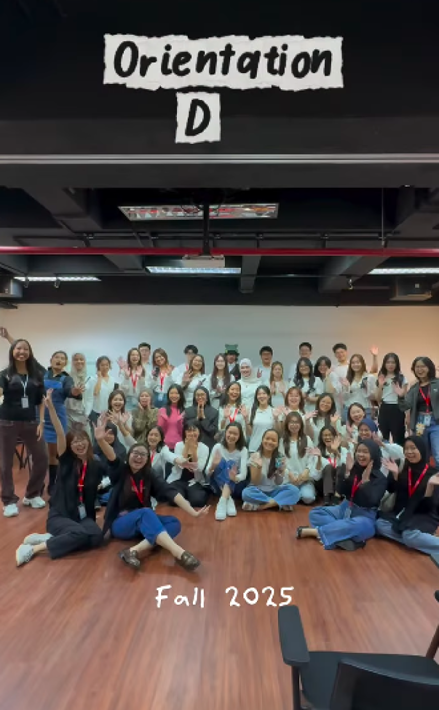 A group of approximately 50 people are gathered indoors for 