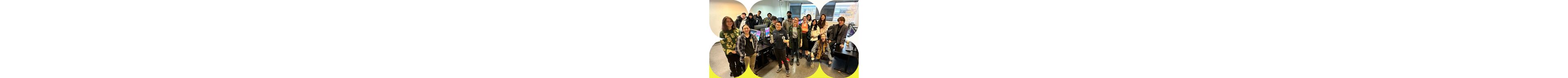A diverse group of students sharing a joyful moment in a computer lab, celebrating creativity and collaboration.