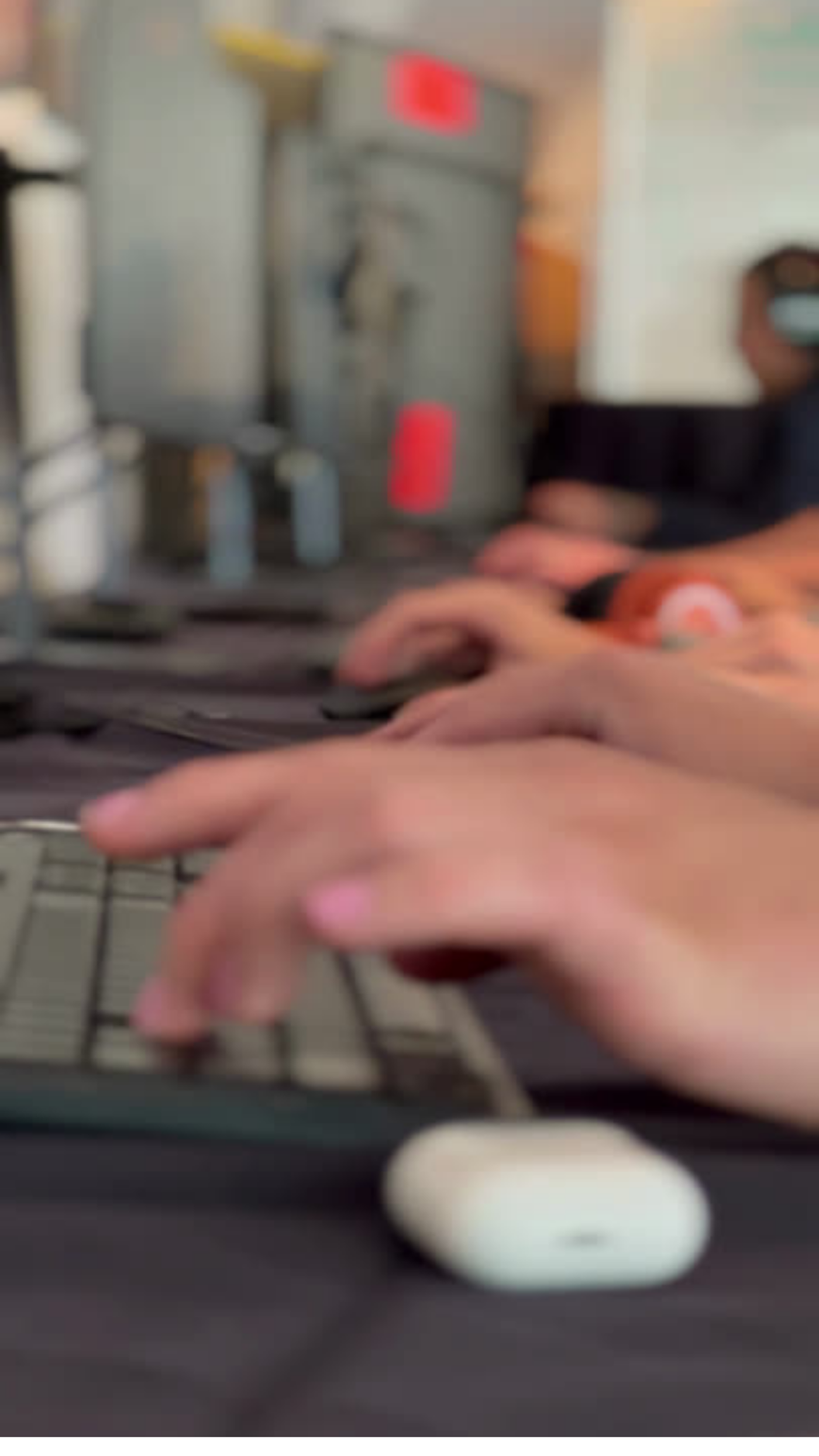 A close-up view of hands swiftly typing on a computer keyboard, capturing the essence of productivity and digital communication.