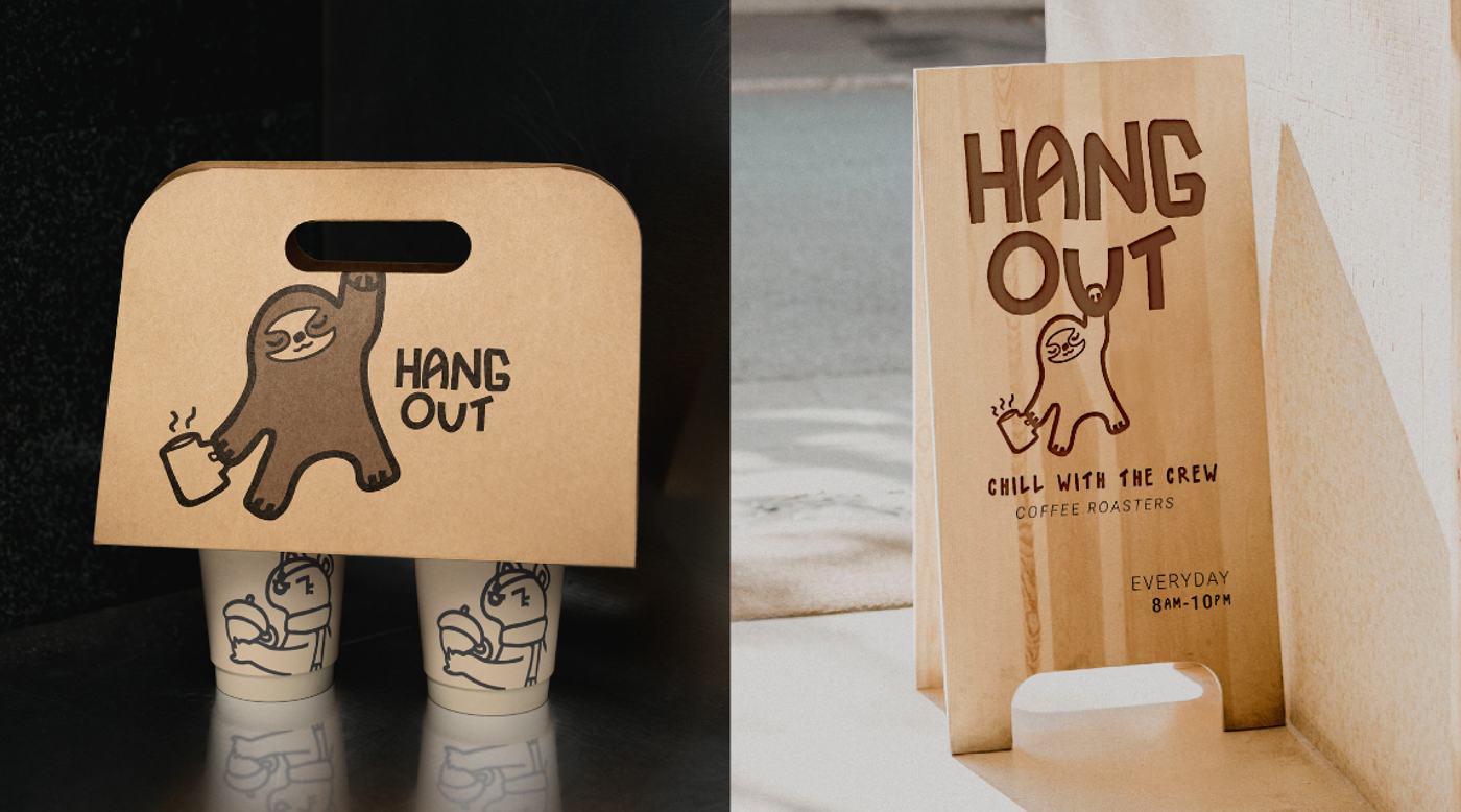 A sloth-themed coffee carrier designed to hold four cups, accompanied by a wooden A-frame sign that reads "HANG OUT COFFEE ROASTERS".