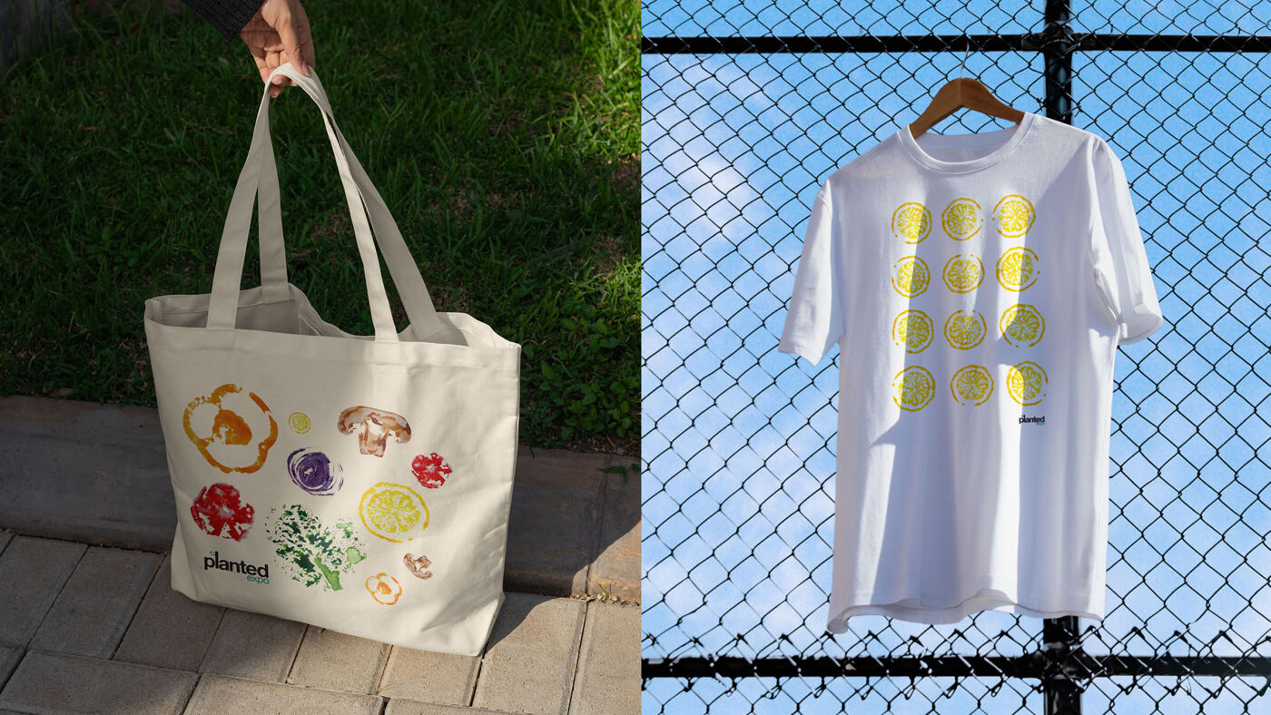 A canvas tote bag and a white t-shirt featuring vegetable and fruit prints, with the "planted" logo.